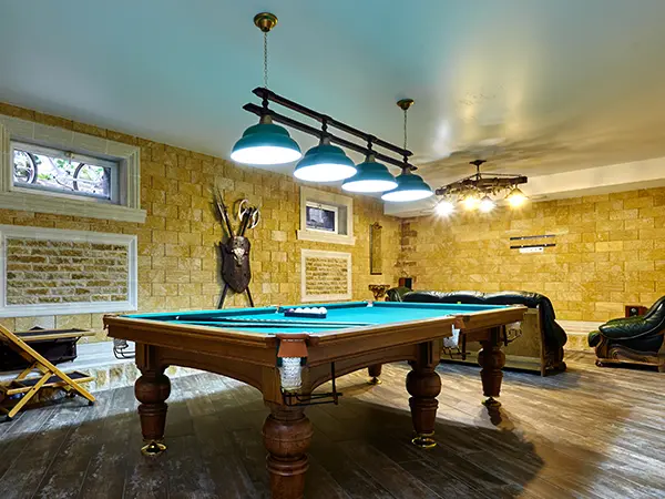 A basement remodel with a pool table