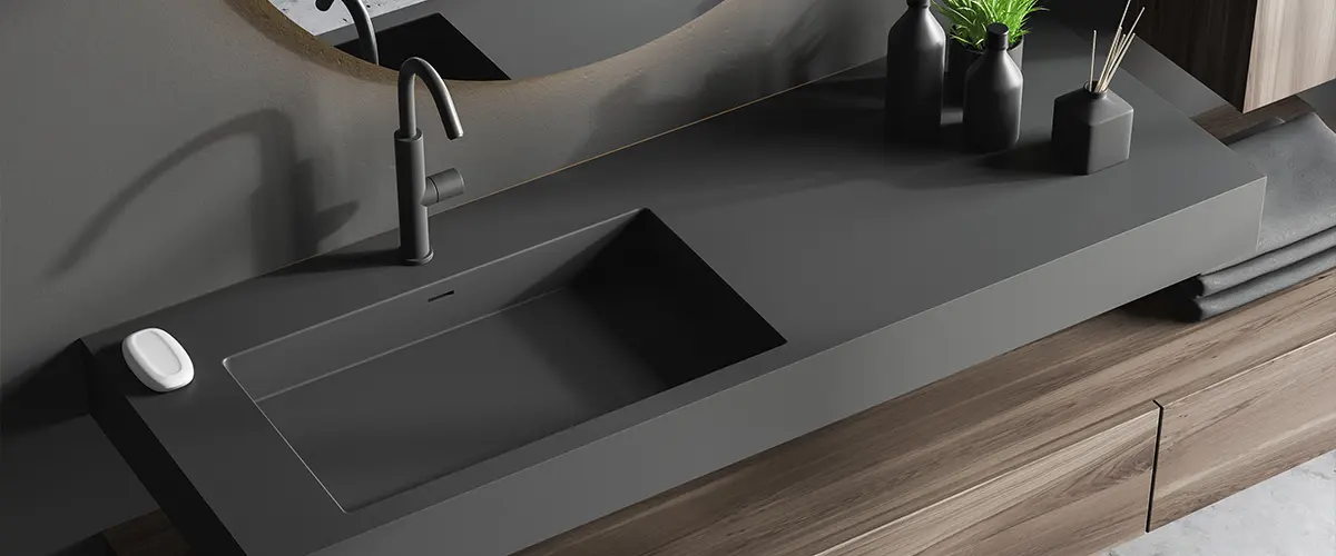 black countertop with dark faucet