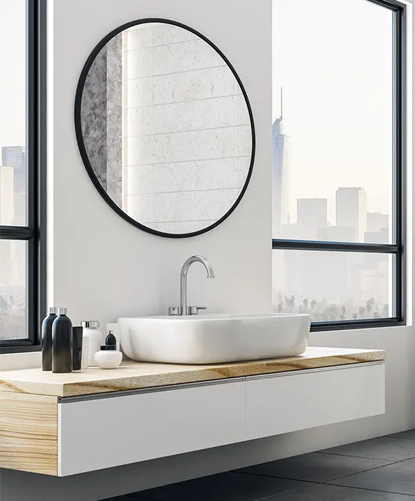 Modern vanity with a round mirror with black frame