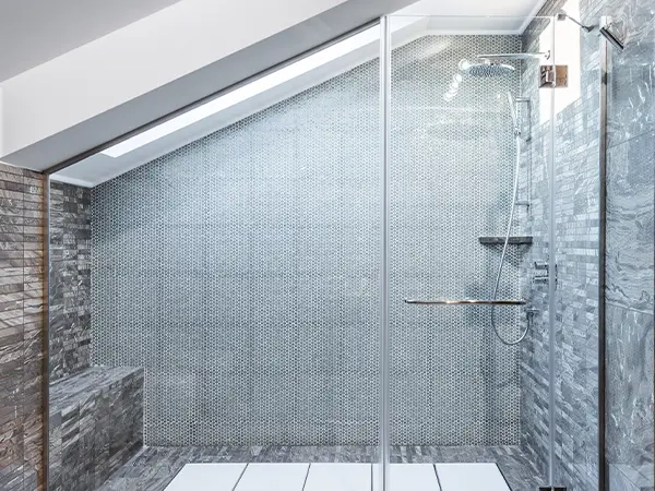 A glass walk-in shower