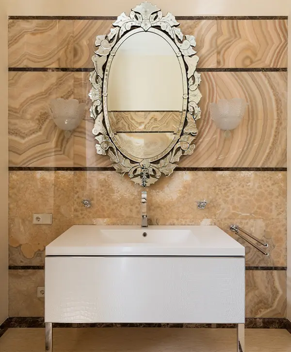 A modern vanity with no hardware and a beautiful mirror