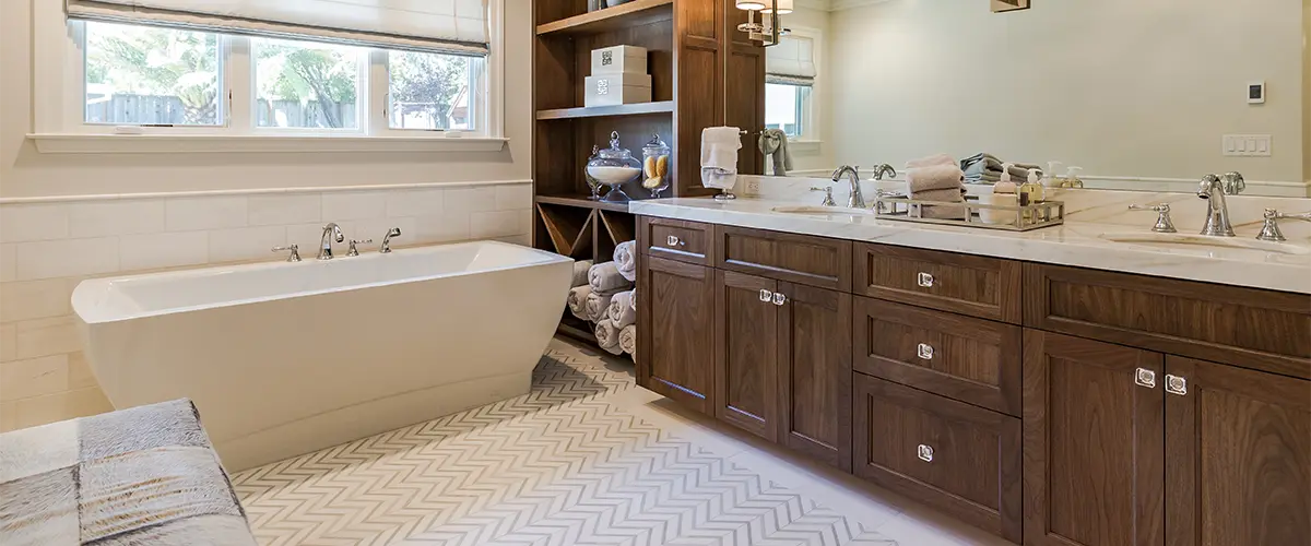 Bathroom remodeling companies that worked on a double wood vanity with freestanding tub and tile flooring