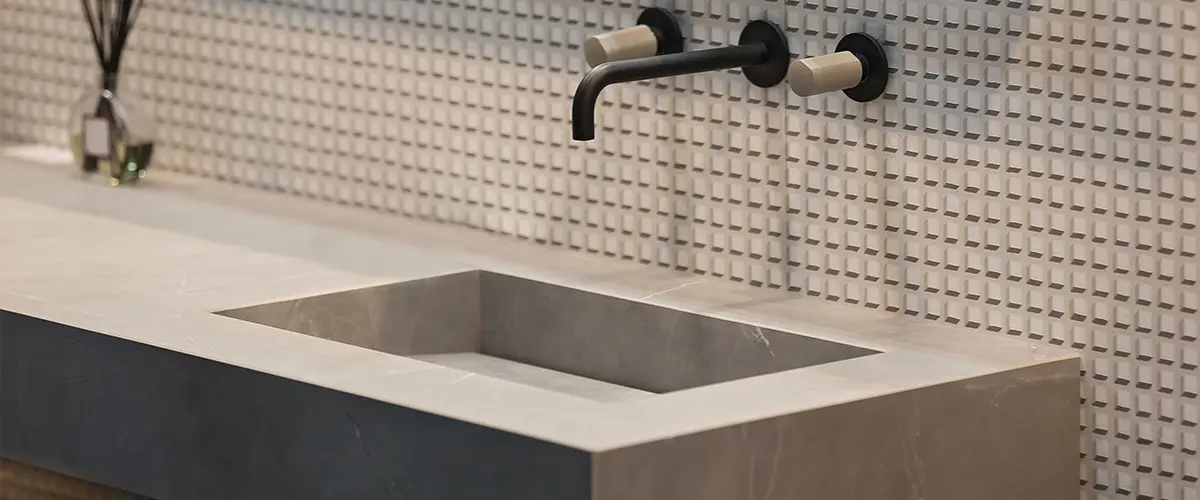 Concrete countertop with a black faucet