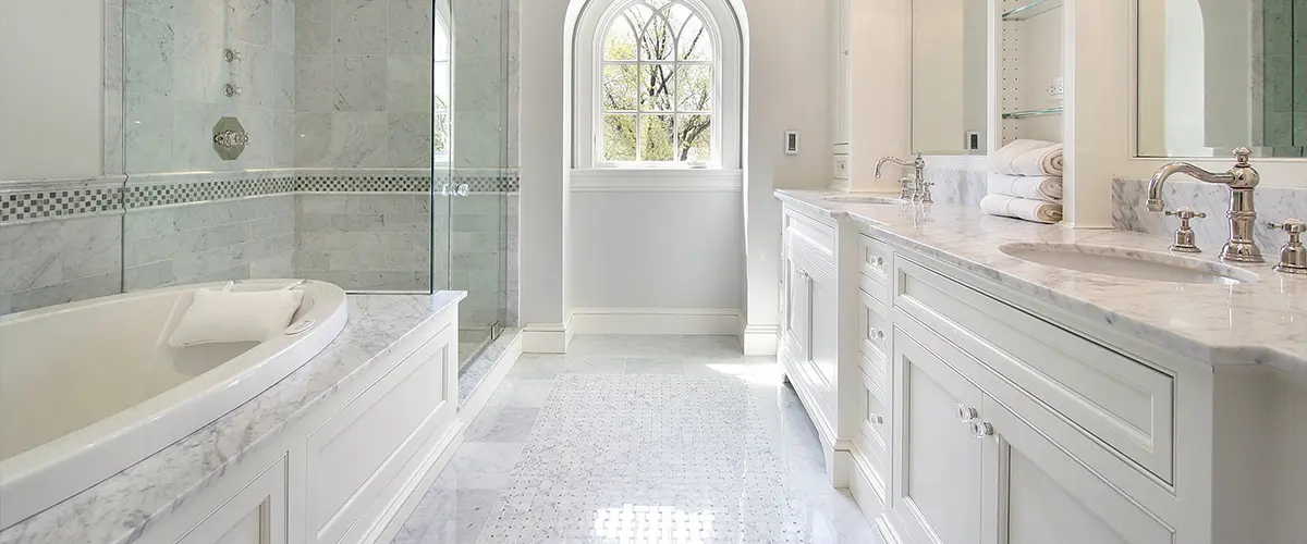 A fancy bathroom with tile and marble