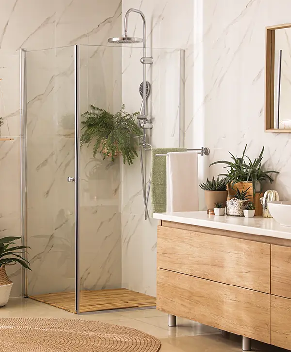 A bathroom with wood features and a lot of plants with a glass walk-in shower