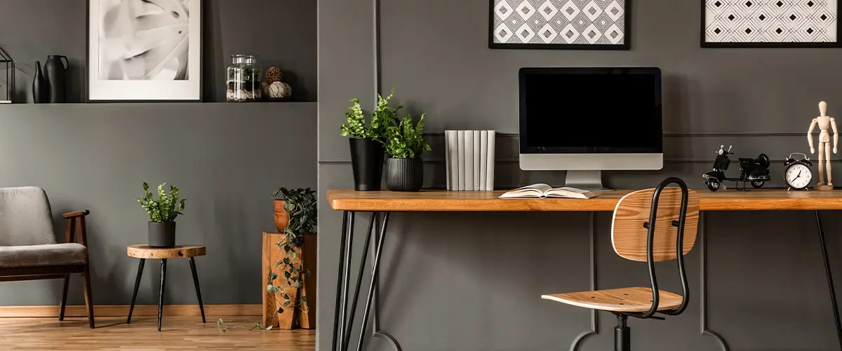 An office in a basement with dark gray walls