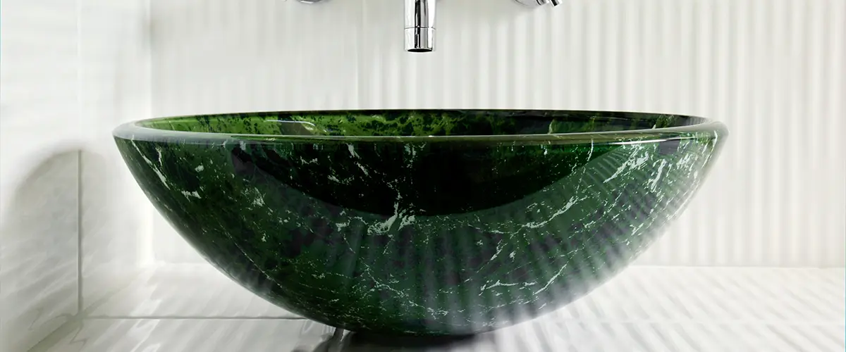 Green vessel sink in bathroom